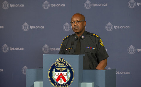 A man at a podium in TPS uniform
