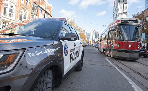 A police suv and streetcar