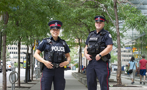 A man and woman in TPS uniform