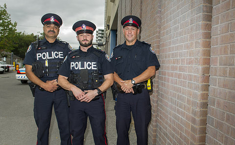 Three men in TPS uniform