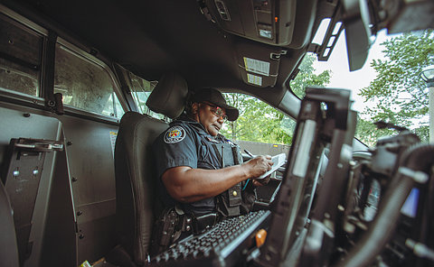 A police officer in a police car