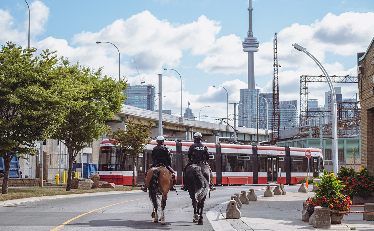 Two police officers on horseback with skyline in background
