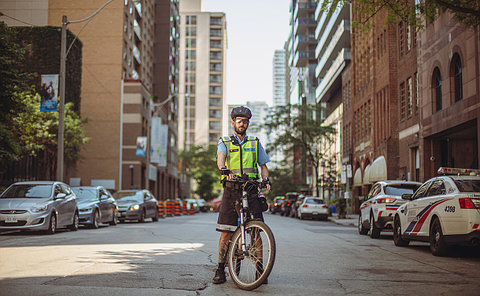 A parking officer on a bike