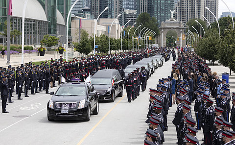 Rows of officers near hearse