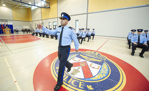 A man in TPS special constable uniform marching